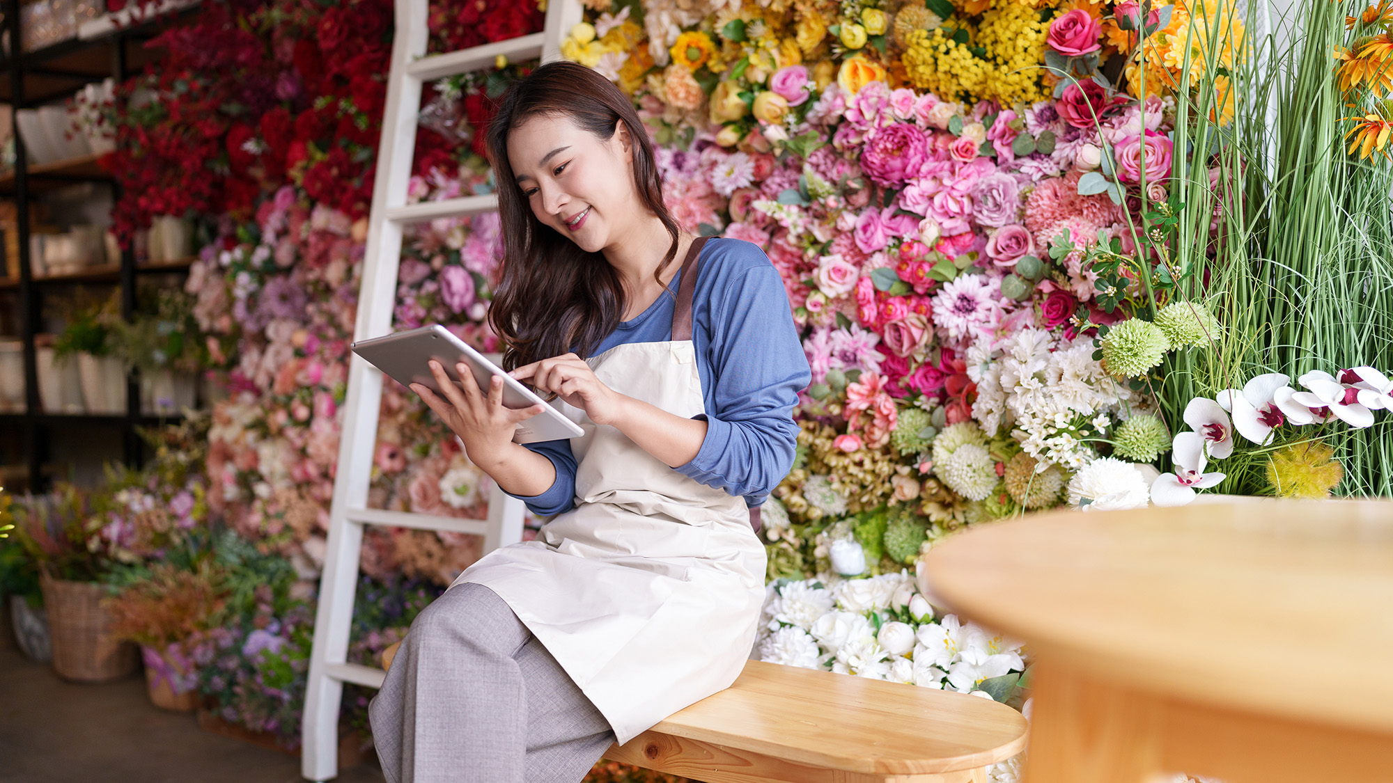 Small business owner uses tablet