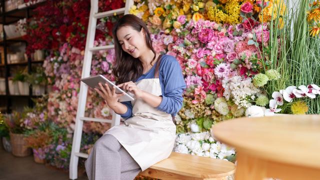 Small business owner uses tablet